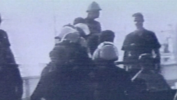Screen capture of Portia Cobb'sshort film, showing a group of police officers wearing helmets