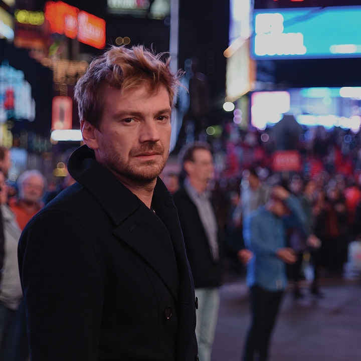 A still from Julia Solomonoff's third feature film, Nadie nos mira (Nobody's Watching). Nico (played by Guillermo Pfening) stands in the center of Times Square amidst a crowd of people.