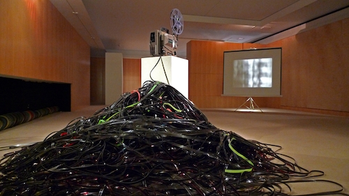 Sandra Gibson and Luis Recorder, Light Spill, 2005, modified 16-mm projector, film, screen, dimensions variable.