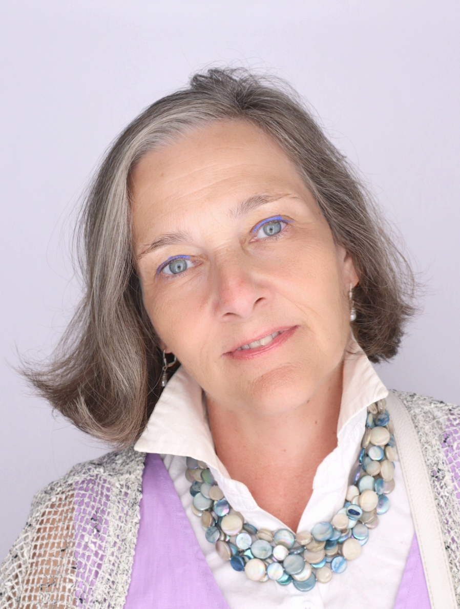 Headshot of Therese Bruck with purple background