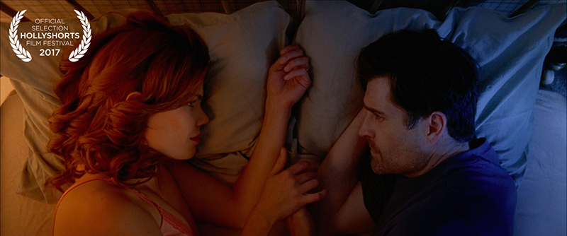 Film Still from Goodnight Eulogy, couple in bed looking at each other