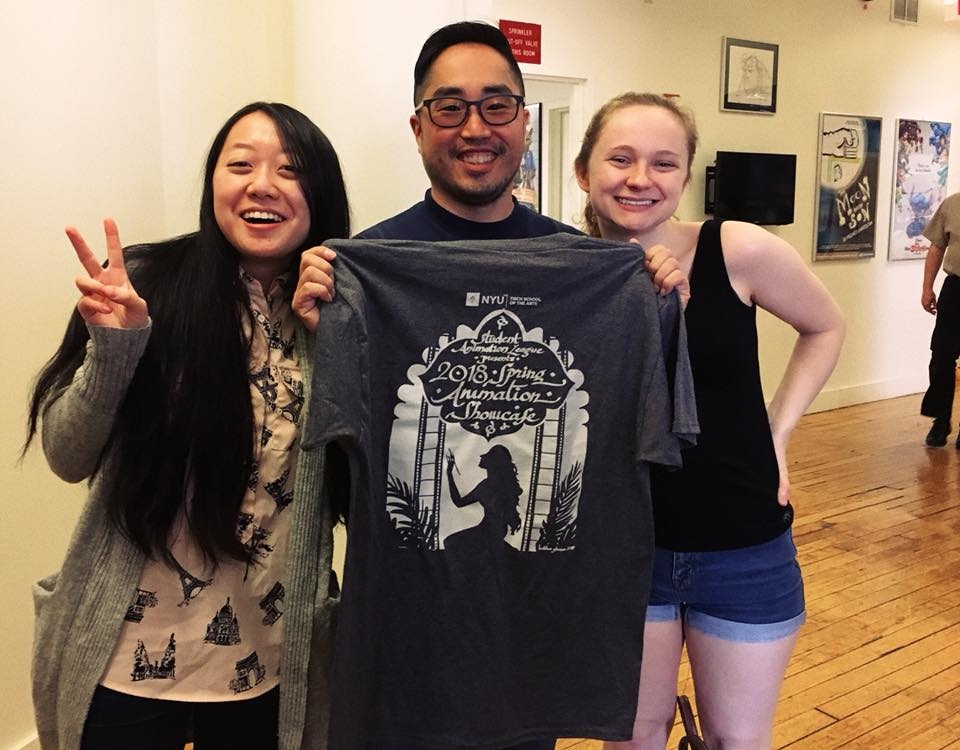 Professor Sang-Jin Bae holds up our animation showcase t-shrit