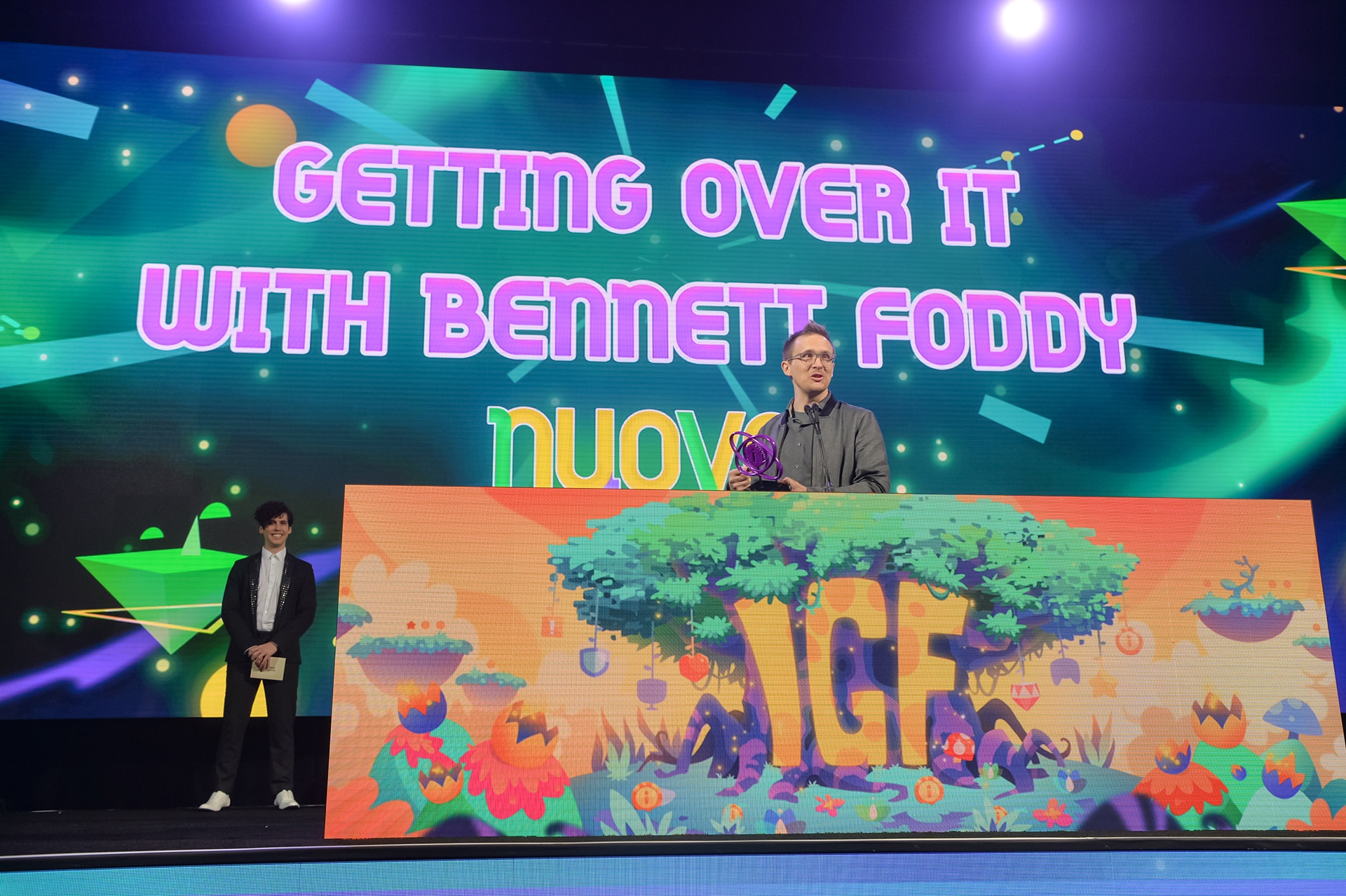 Bennett Foddy holding his 2018 IGF Award at the Award Show