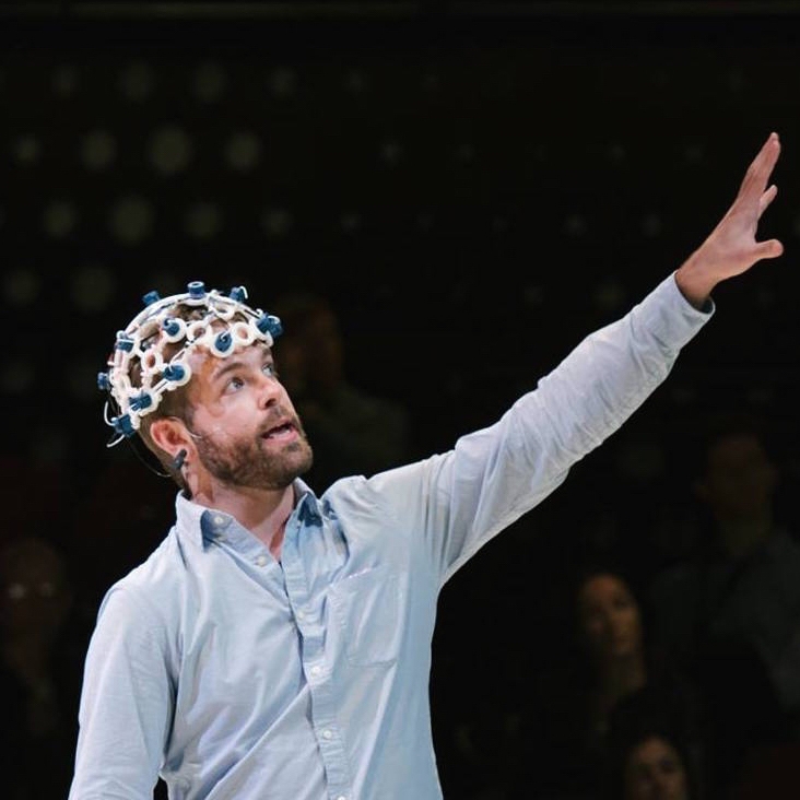 Image of Conor using technologic equipment on his head