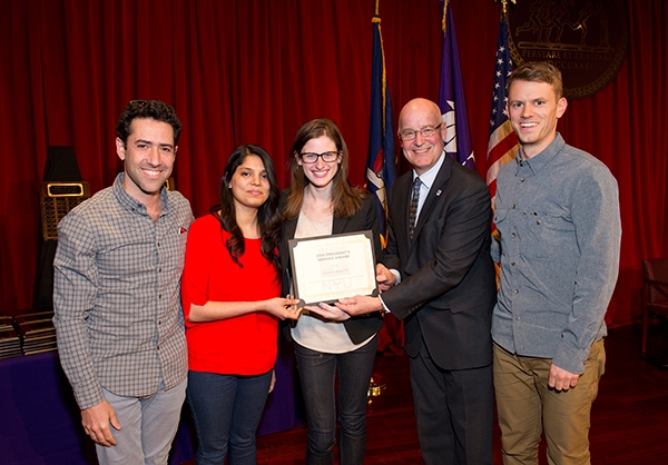 5 people smiling and showing a certificate