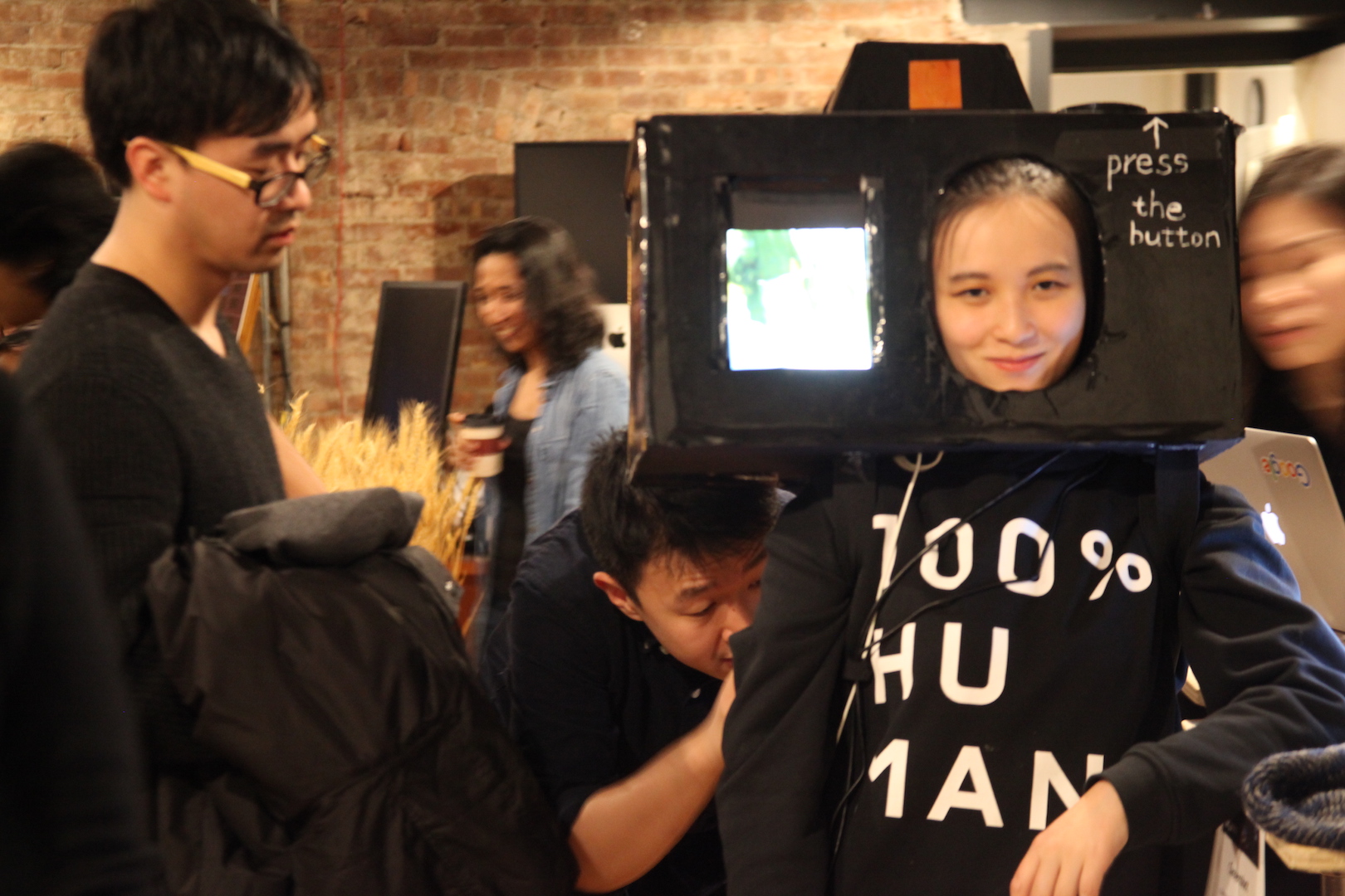 A woman wearing a gigantic looking camera on her head