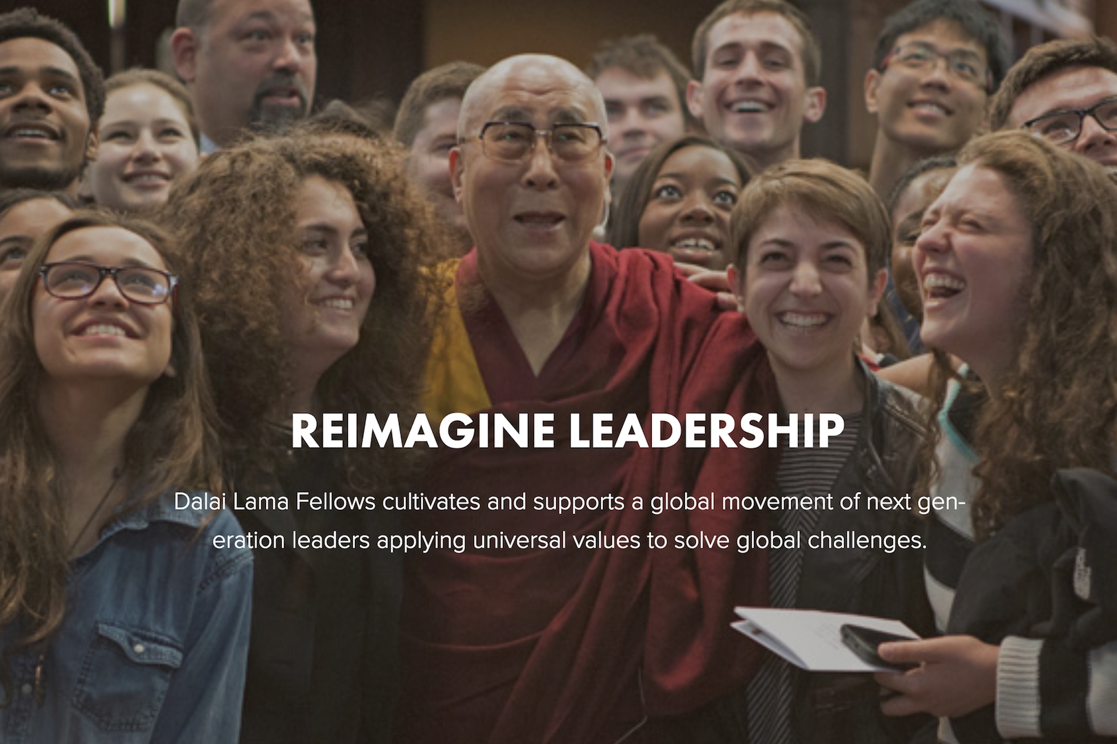 Image showing Dalai Lama surrounded by happy looking fellows; Reimagine Leadership: Dalai Lama Fellows cultivates and supports a global movement of next generation leaders applying universal values to solve global challenges