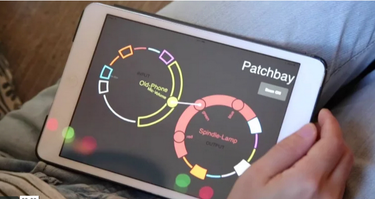 an ipad showing an app to control networked objects