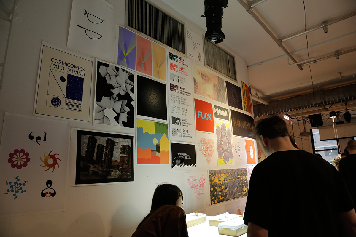 A wall full of colorful graphic design posters