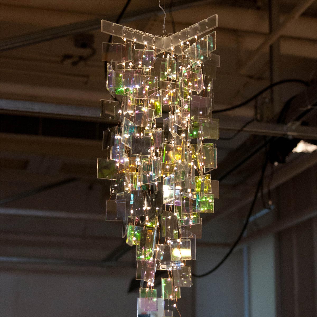 an acrylic chandelier lit up by LED's