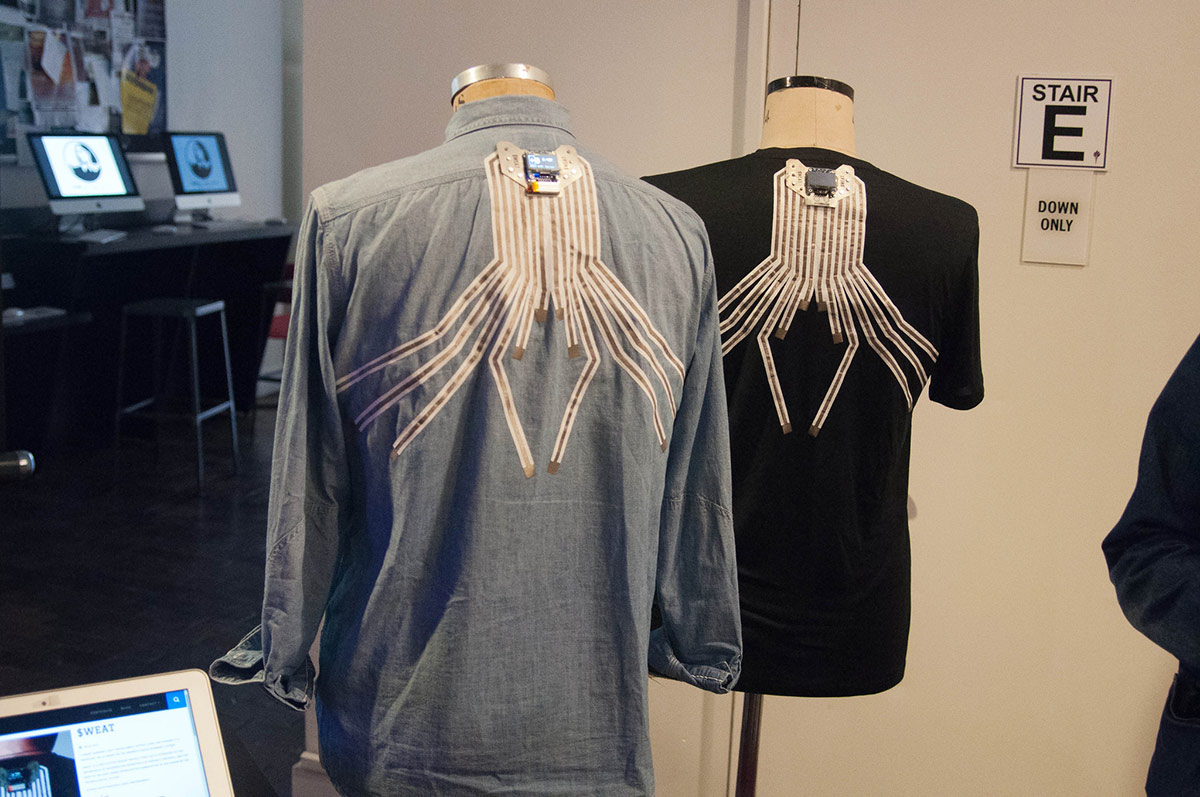 2 shirts with conductive thread sensors on the back