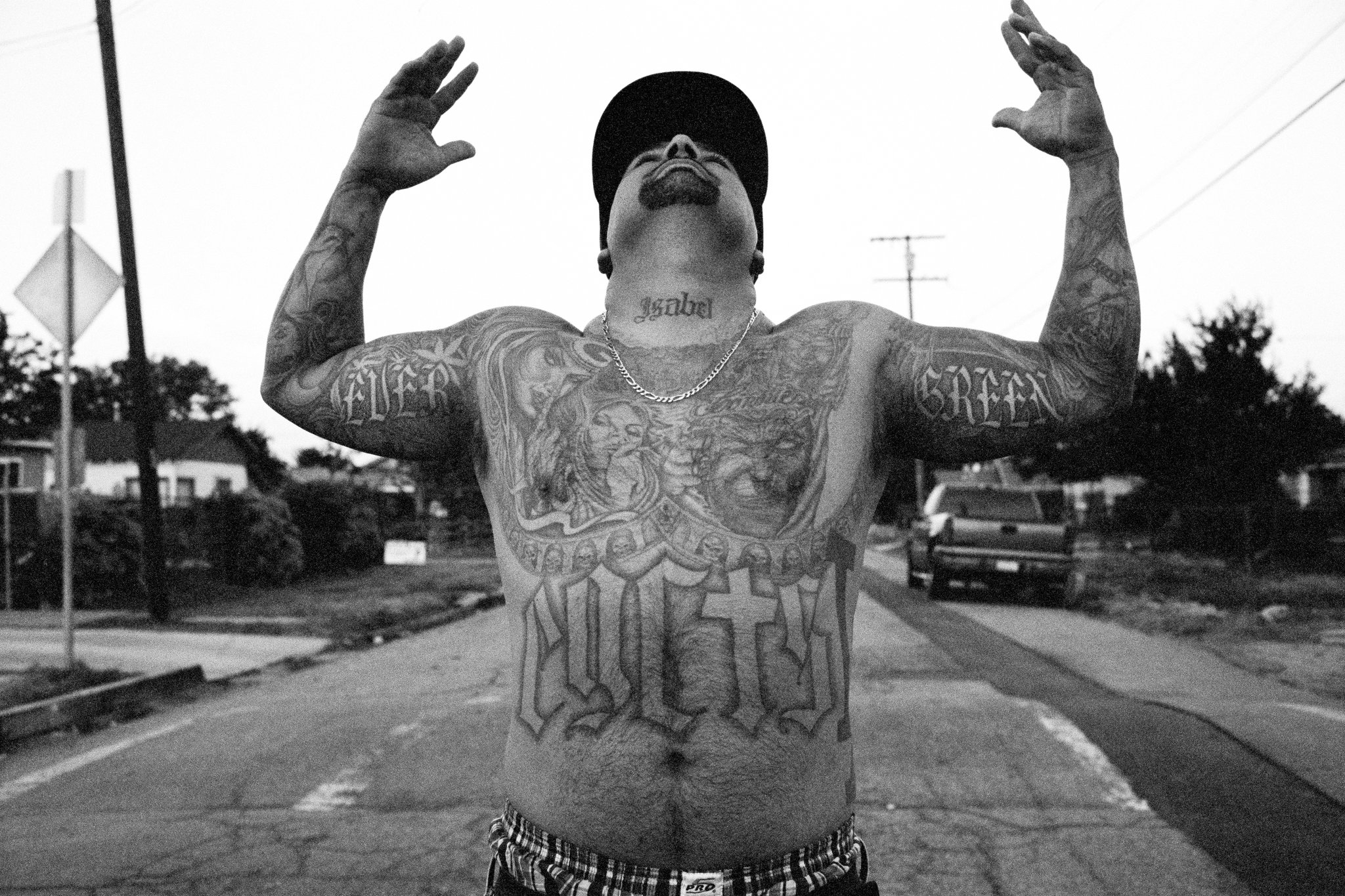 street-side portrait of a tattooed man