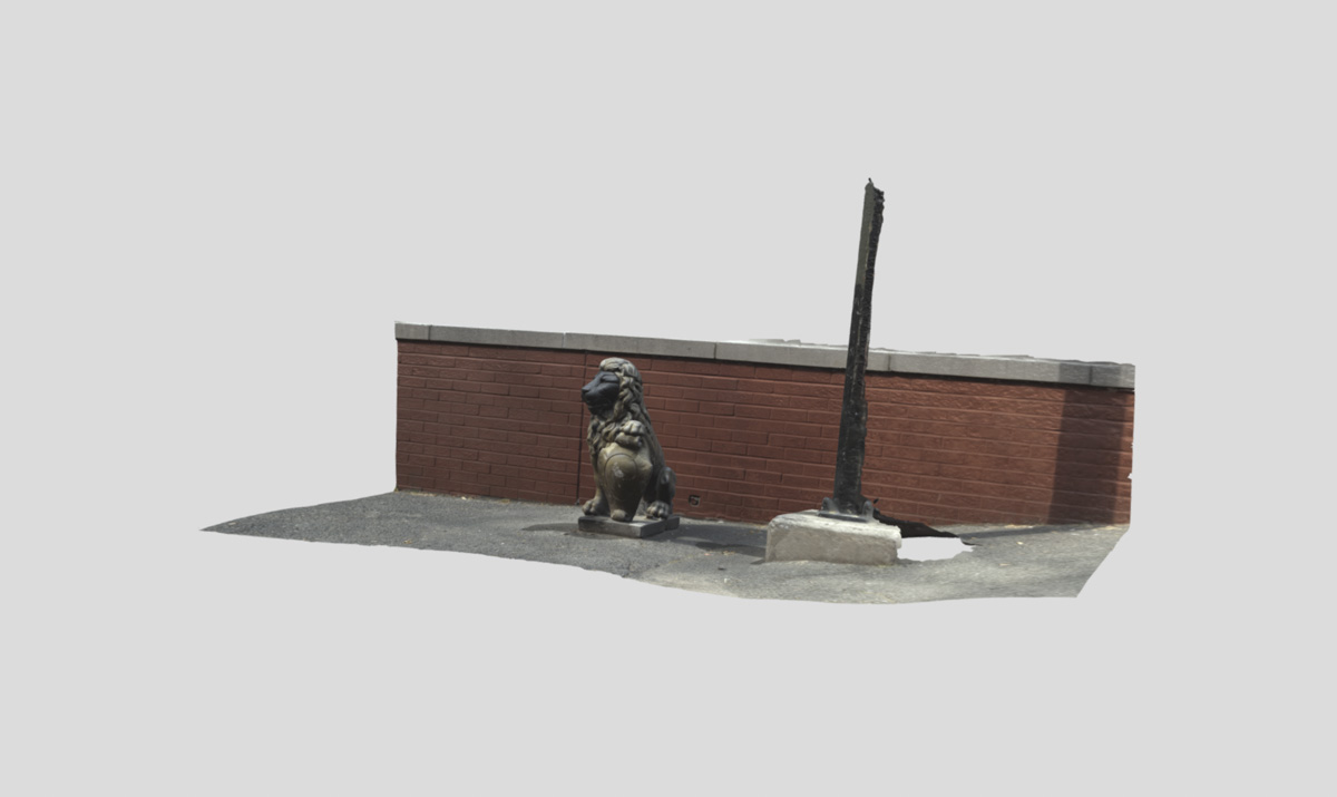 screenshot of a 3D rendered sidwalk, wall, and lion statue