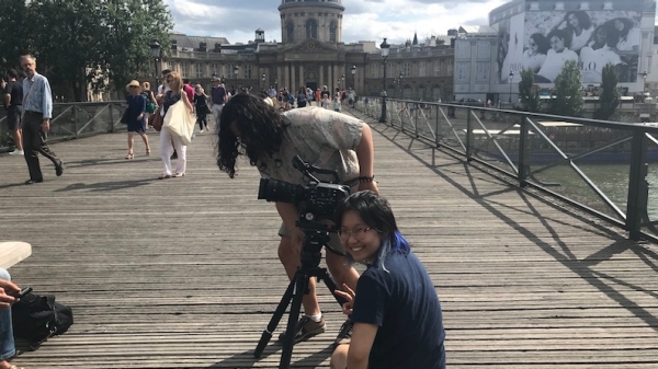 Students shooting on the Pont des Arts in Paris.