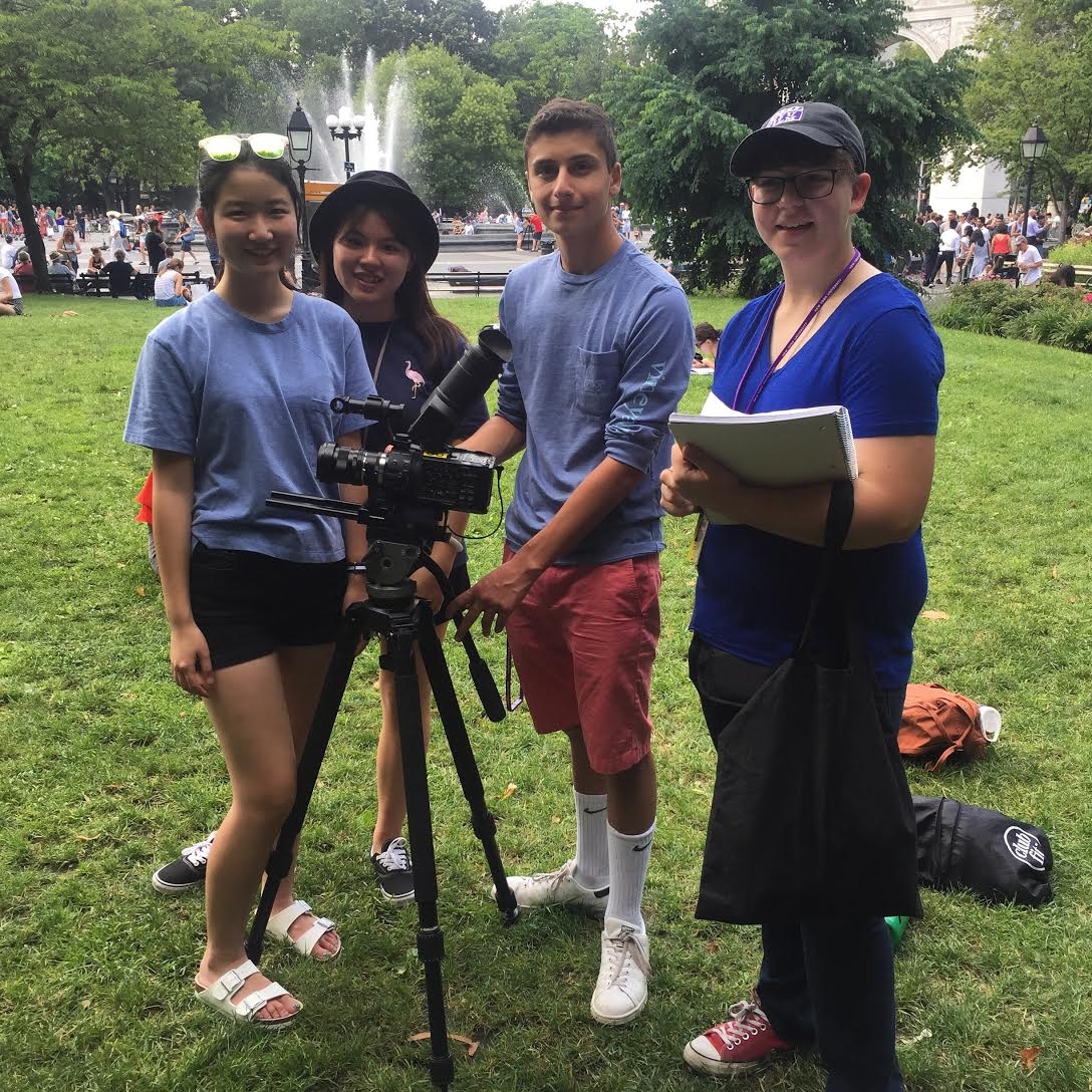 Students shooting a film project in Washington Square Park.