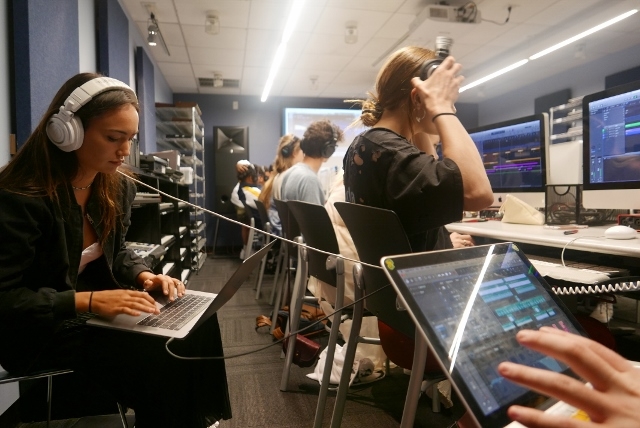 Recorded Music students working on laptops in the Clive Davis Institute computer lab.