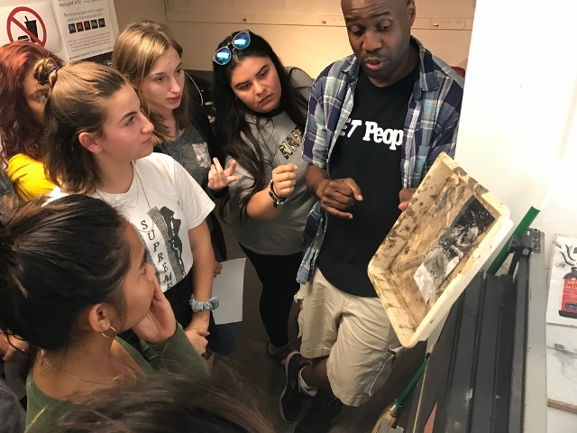 Photography instructor Bayete Ross Smith teaching Tisch Summer High School Photography students.