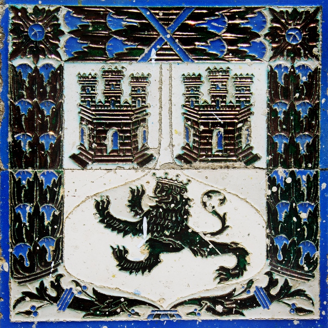 Blue, white, and grey family crest with lion painted ceramic tiles in Havana.
