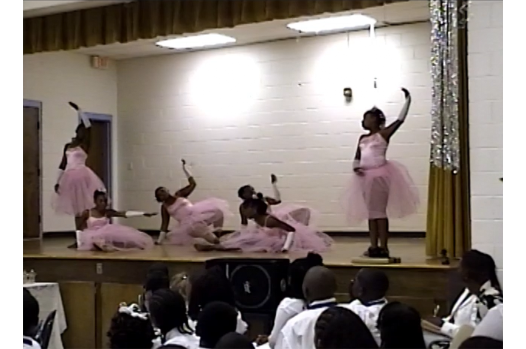 Five girls dancing ballet on stage