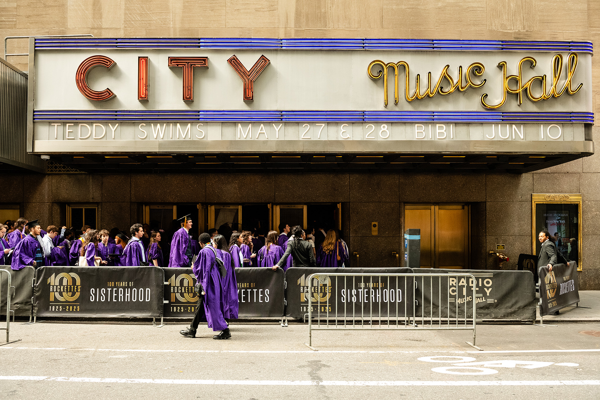 Radio City Music Hall sign with Tisch grads in front