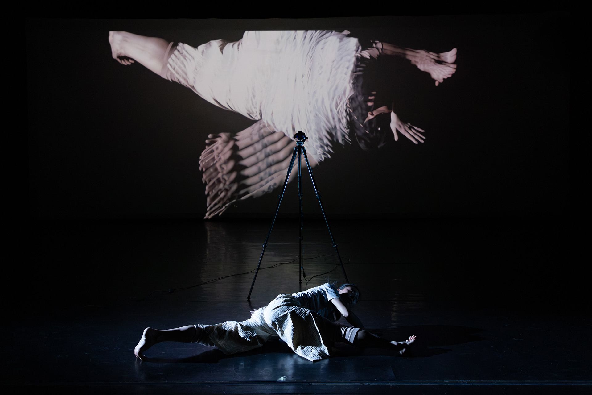 Dance performance on a dark stage