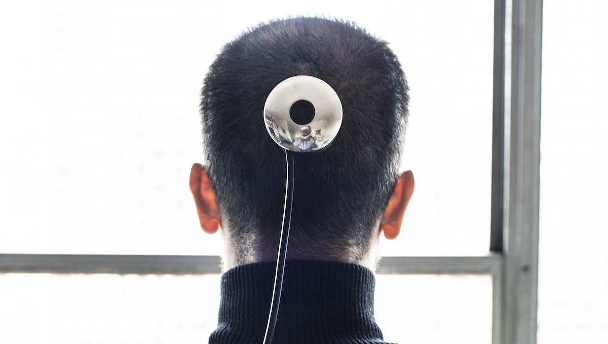 Professor Wafaa Bilal displays a camera that he had installed in the back of his head in his home in the West Village on December 2nd, 2010.  The camera is part of an art project called "3rd I" and will transmit images to a website throughout each day for a year.

CREDIT: Bryan Derballa for The Wall Street Journal
NYCAMERAPROF