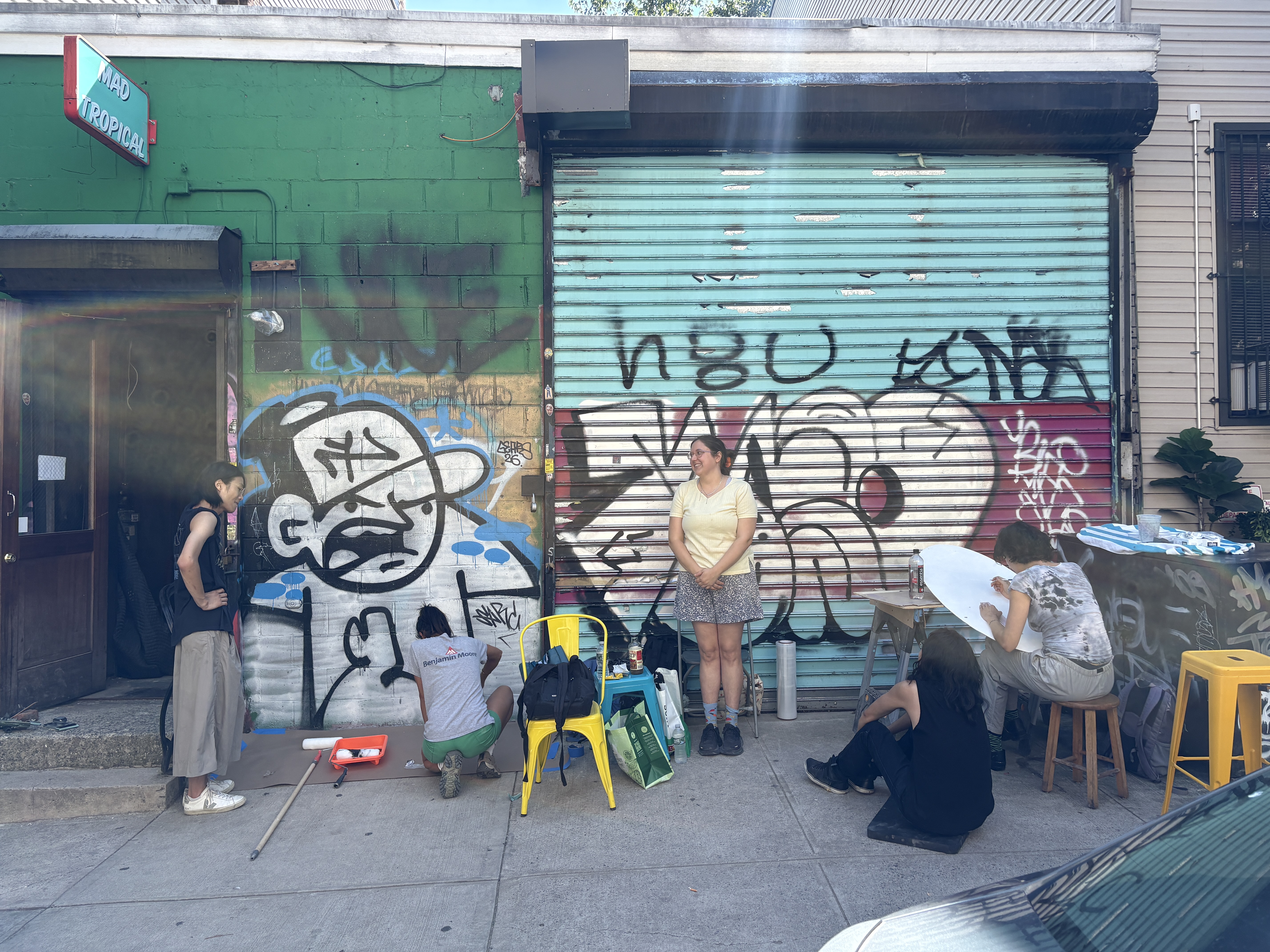 Karma outside Shorts Theater surrounded by staff & volunteers