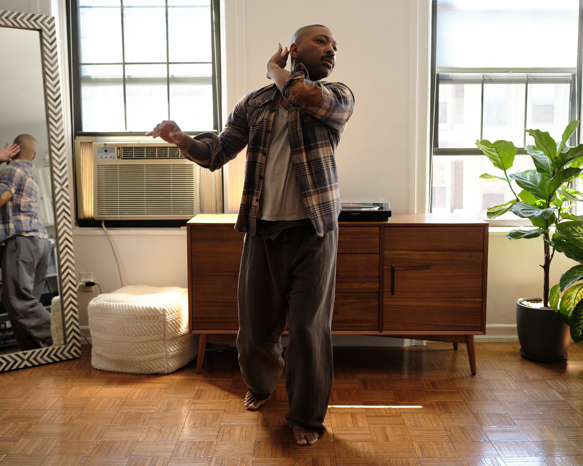Kyle Abraham in his Brooklyn apartment, courtesy of the New York Times