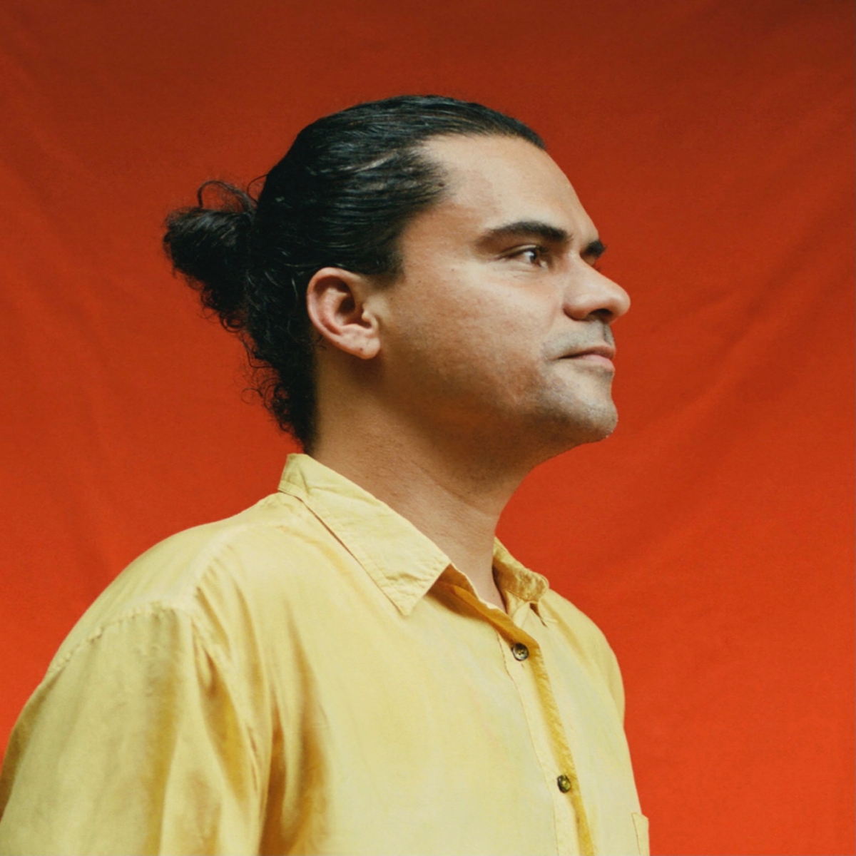 Luis Rincón Alba headshot red background