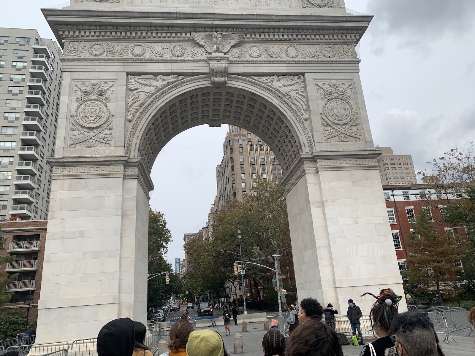 A picture of members of the Arts Politics 2022 cohort looking at the Washington Square Park arch.
