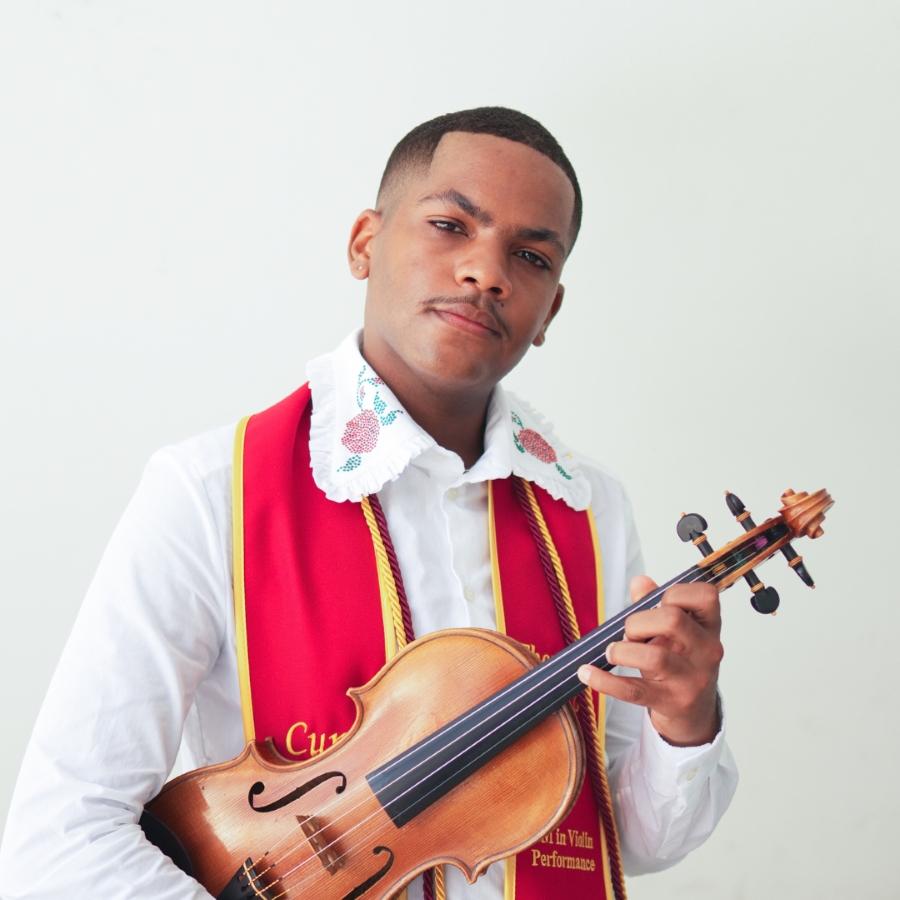 Semaj Murphy holding a violin