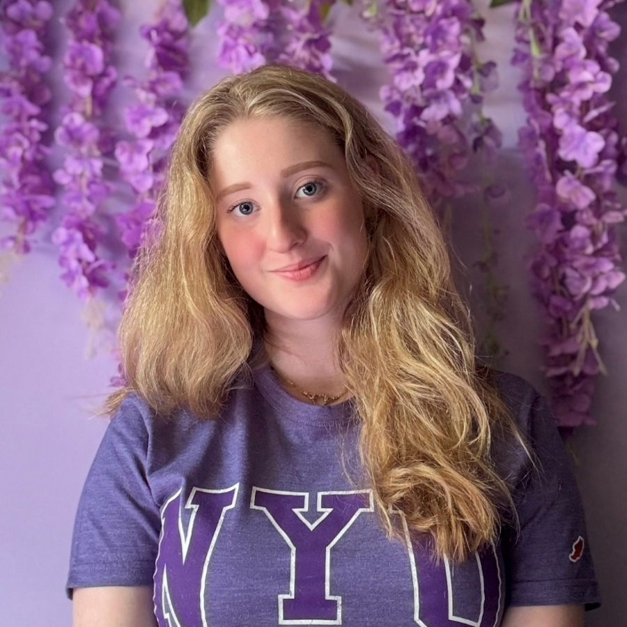 Stella Lempert wearing purple NYU shirt