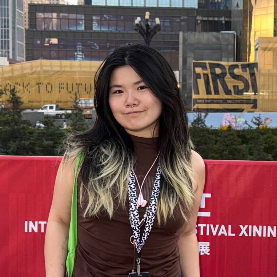 Yuxuan Li wearing a brown shirt
