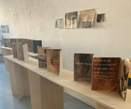 accordion books on art plint in exhibition