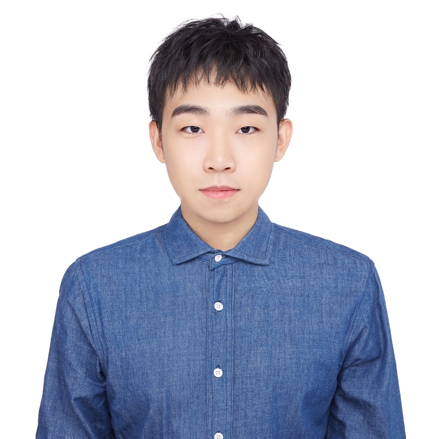 Portrait of Tianguang in blue button down against white background