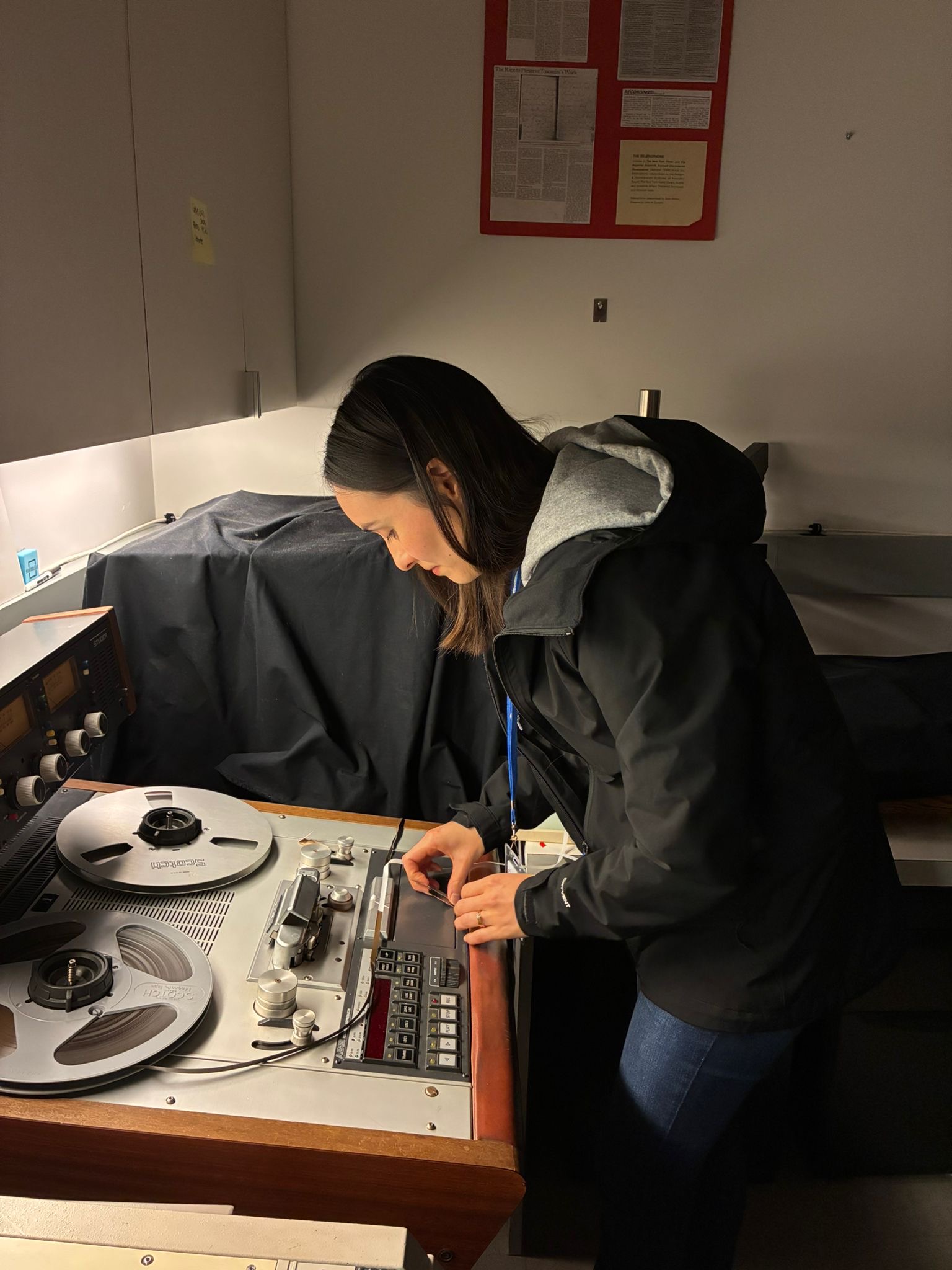 person standing at film scanner