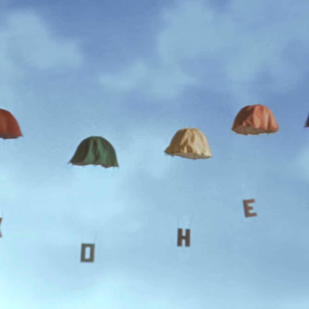 Five parachutes in different colors, each one attached to a cyrillic letter, that spells "The end" in Russian.