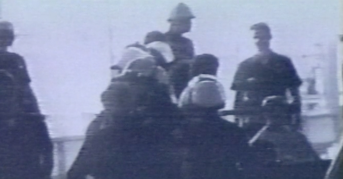 Screen capture of Portia Cobb'sshort film, showing a group of police officers wearing helmets