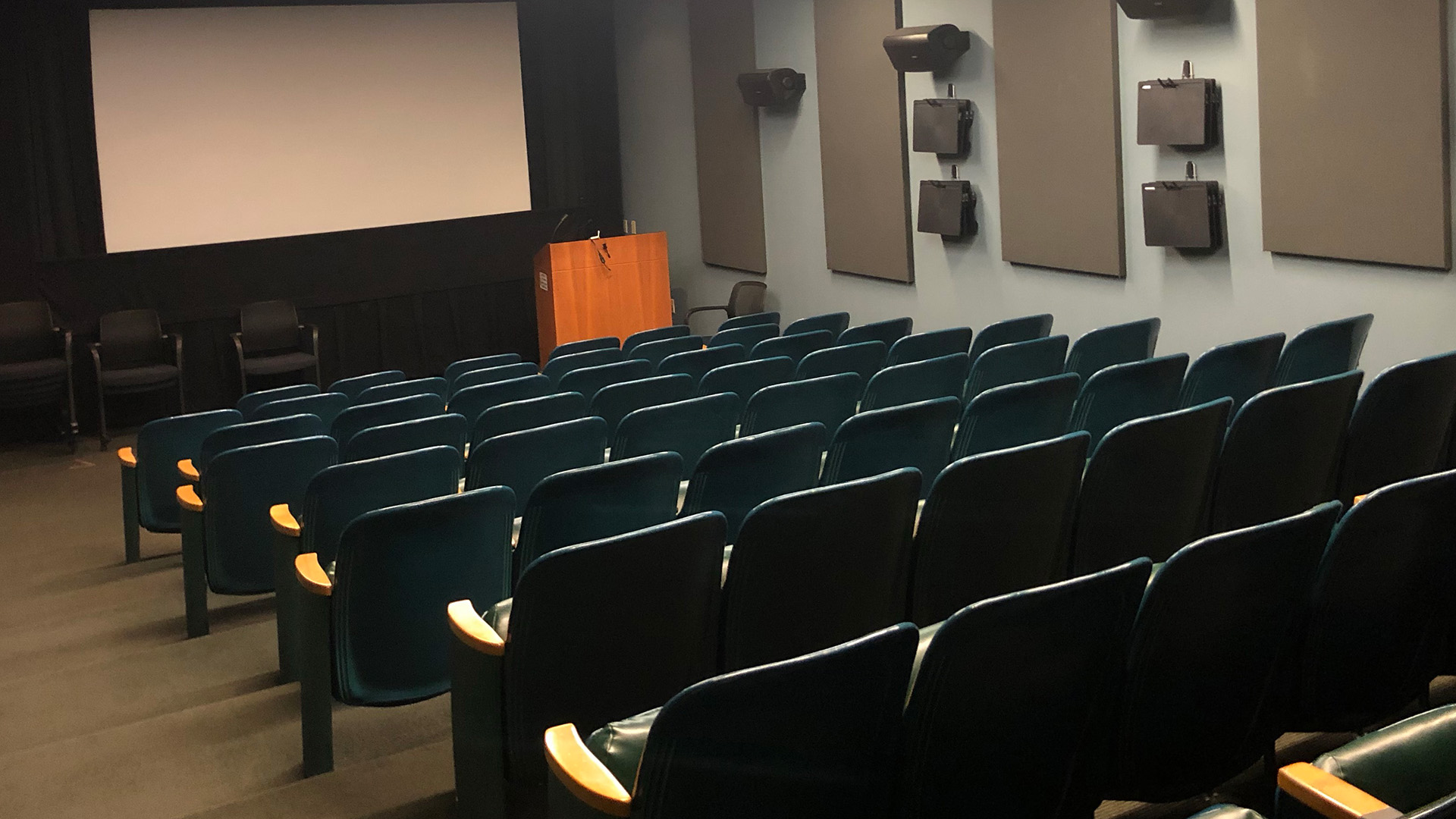 Chairs in the Michelson Theater facing a screen