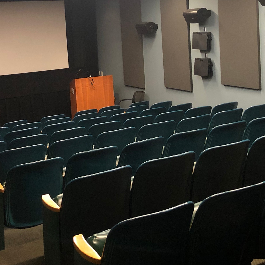 Chairs in the Michelson Theater facing a screen