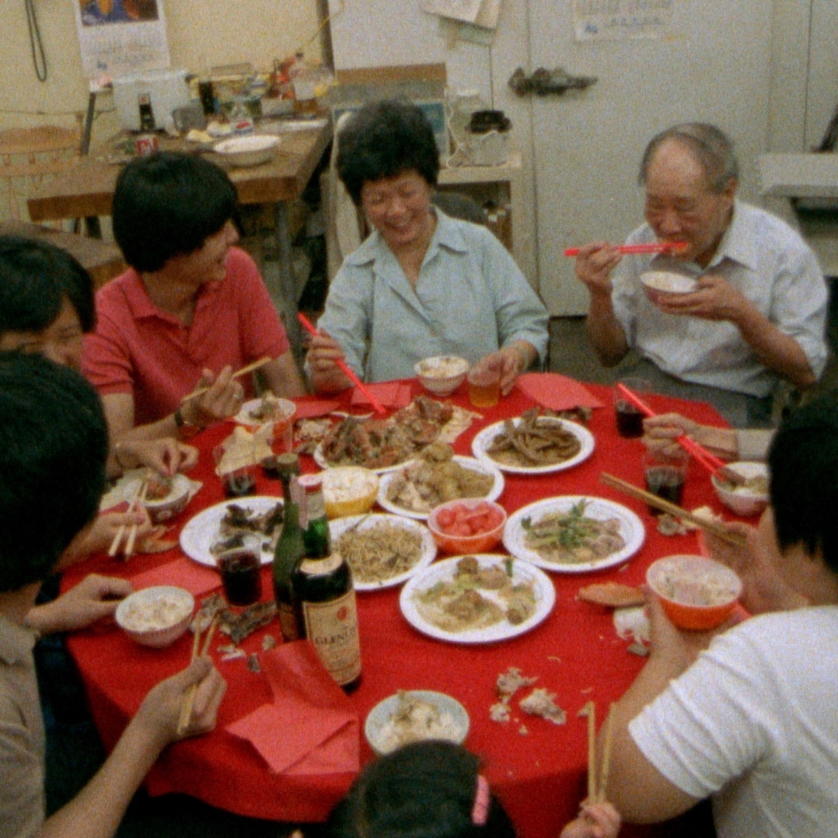 Still from Mississippi Triangle: Family sitting around a table eating