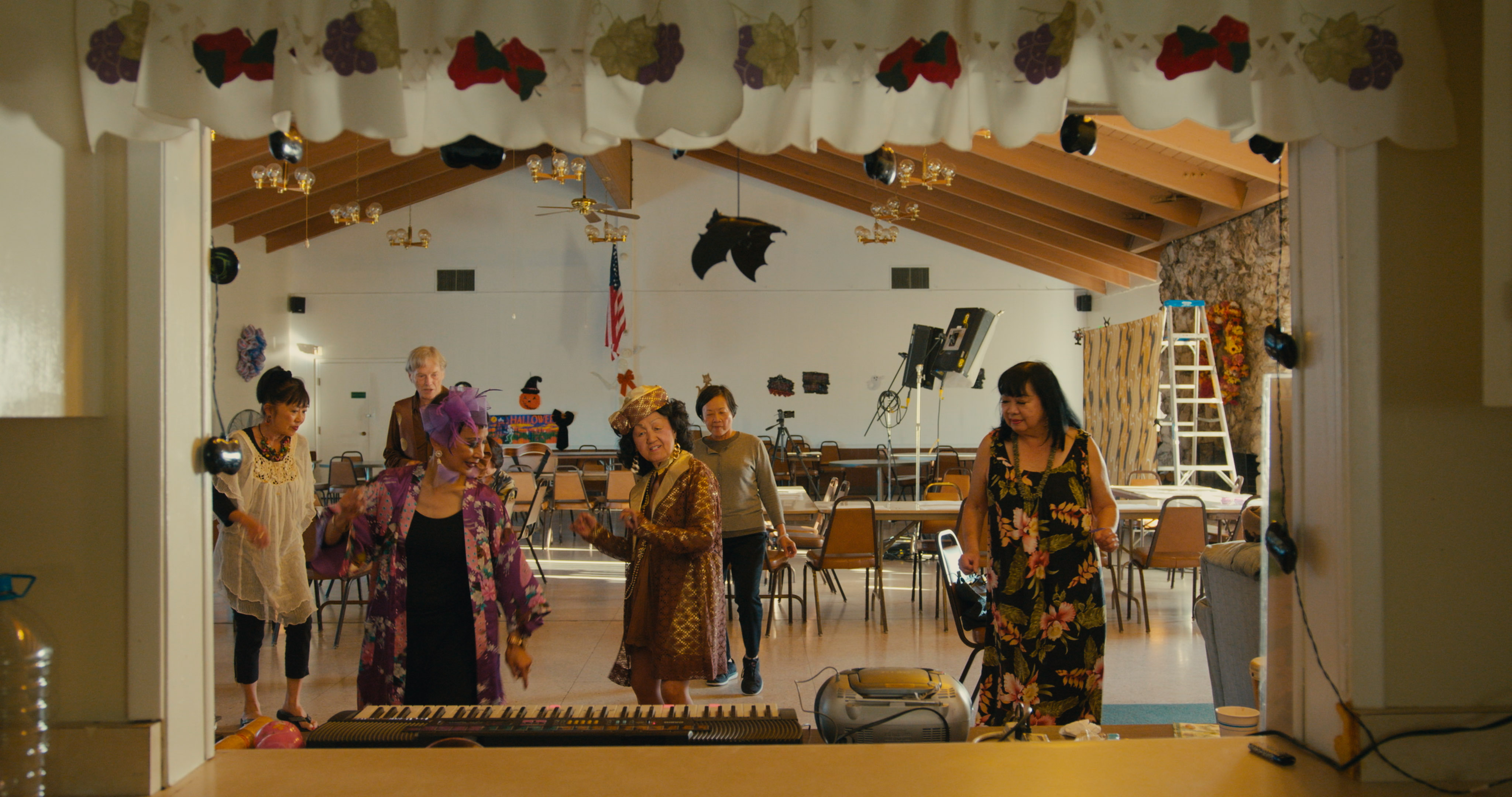 Five women dancing in a music room