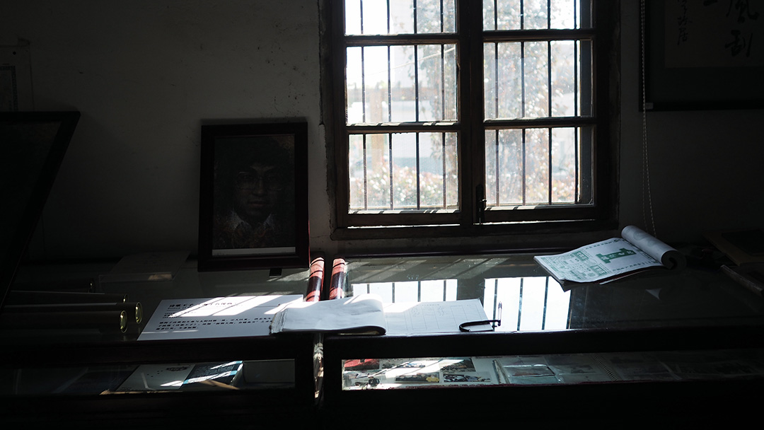 Desk with papers strewn about.