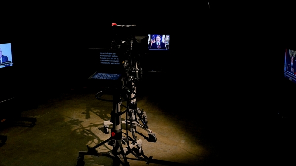 Three screens, camera and teleprompter