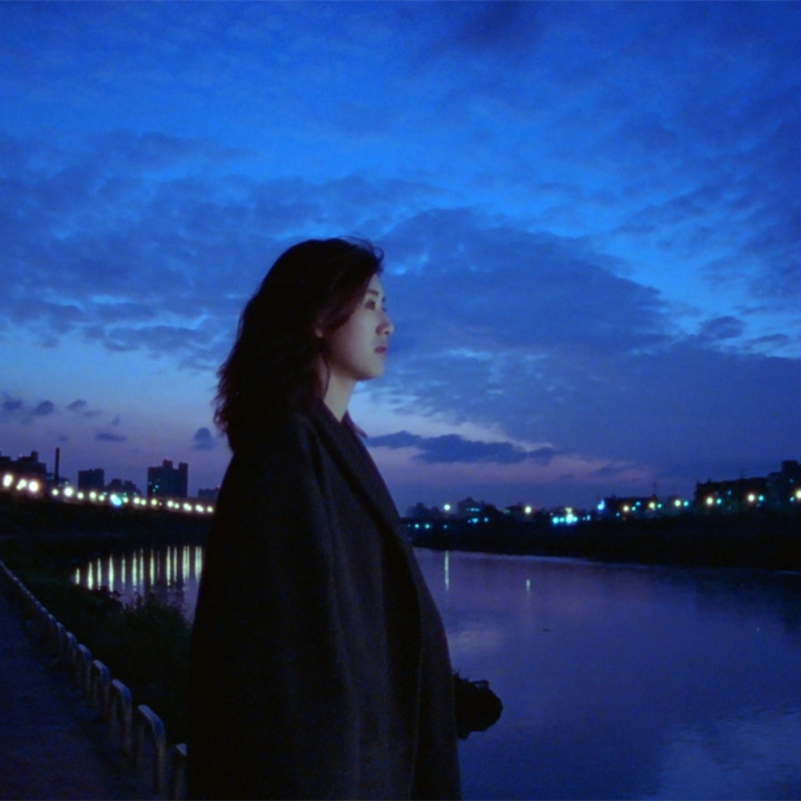 A still from Blue Moon: A woman looking solemn.