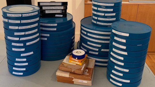 stack of blue film canisters