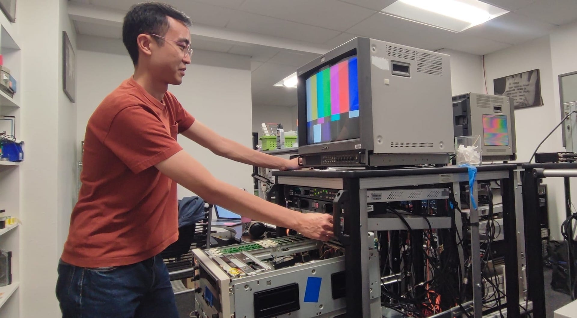 person stands at an archive machine