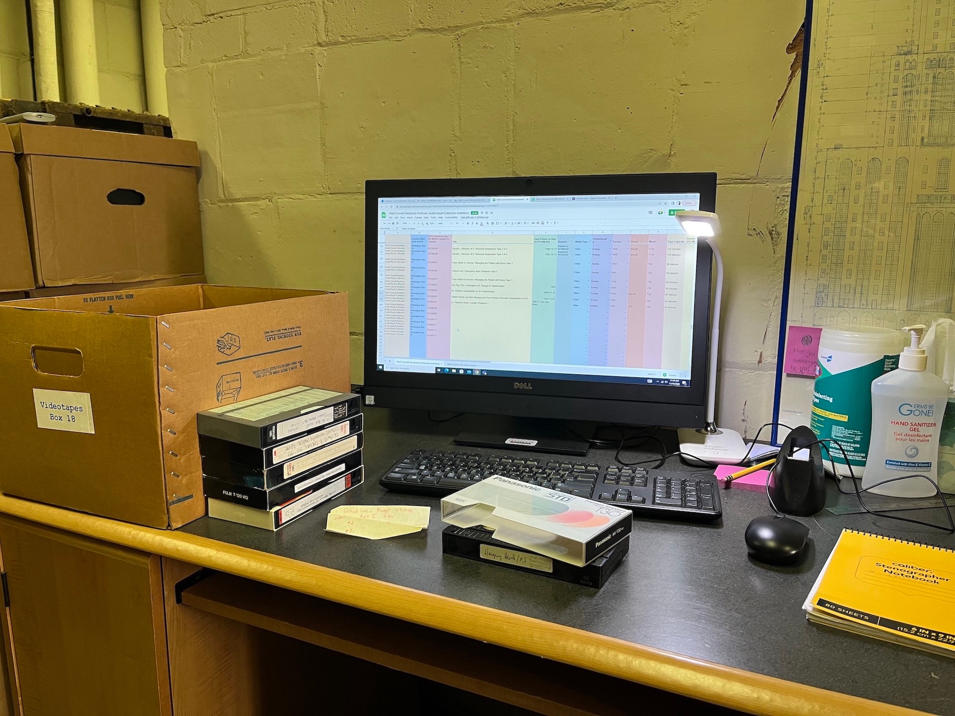 image of a laptop in an archival office space