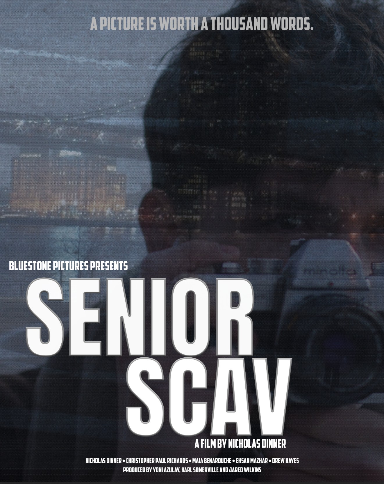 A figure taking a photo, camera brought to his eye, transparently overlayed on a cityscape in the background at night. Text reads: A picture's worth a thousand words. Bluestone Pictures Presents: Senior Scav, a film by Nicholas Dinner. Christopher Paul Richards, Maia Benarouche, Eshan Mazhar, Drew Hayes, produced by Yoni Azulav, Karl Somerville, and Jared Wilkins