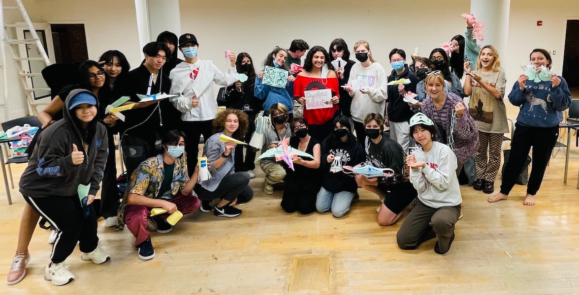 Students pose together at the end of a workshop